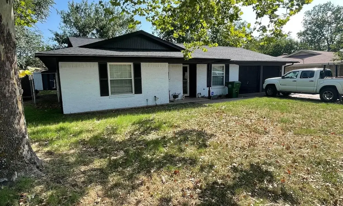 Professional roofing crew working on a residential roof in Fort Irwin